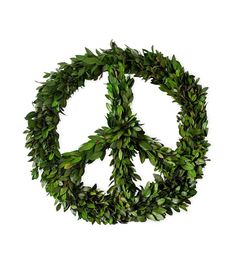 a peace sign made out of green leaves