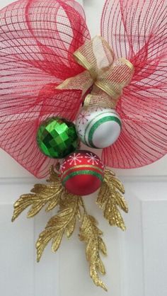 a door hanger decorated with christmas ornaments