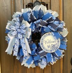 a blue and white wreath that says welcome