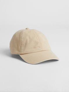 a beige baseball cap on a white background