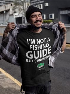 I'm not a fishing guide, but $100 is $100. Have some fun with this tshirt. Remember, you're just one cast away. Link to women's tshirt. - https://www.etsy.com/listing/1104203440 Link to YouTube FishOutLoud - https://bit.ly/YouTubeFOLa Please Note: We do not charge shipping EVER and we offer the highest quality, highest customer review shirts anywhere. This classic unisex jersey short sleeve tee fits like a well-loved favorite. Soft cotton and quality print make users fall in love with it over and over again. These t-shirts have-ribbed knit collars to bolster shaping. The shoulders have taping for better fit over time. Dual side seams hold the garment's shape for longer.  .: 100% Airlume combed and ringspun cotton (fiber content may vary for different colors) .: Light fabric (4.2 oz/yd² (14 Mens Fishing Shirts, Fishing Guide, Fun Shirt, Men Gifts, Customer Review, Cheap Shirts, Fishing Shirts, Outdoor Fun, Unisex Shorts