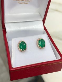 Featured here is a stunning set of oval-cut emerald & diamond stud earrings in fine 14K rose gold. Displayed are deep green emeralds accented by the gorgeous diamond halo gold mount. The earth mined, green emeralds have a desirable lush green color with excellent qualities. These earrings are ideal for everyday use and are the perfect accessory to any outfit. Total Carat Weight: 1.90-Carats Setting Style: Halo Setting Material: 14K/18K Rose, Yellow, Or White Gold Main Stone: Emerald Shape: O Oval Emerald Earrings For Anniversary, Fine Jewelry Oval Emerald Earrings, Oval Emerald Gemstone Earrings, Oval Emerald Earrings For May Birthstone, Emerald Oval Earrings For May Birthstone, Oval Emerald Earrings With Prong Setting, Emerald Studs, Rose Gold Stud Earrings, Emerald Halo