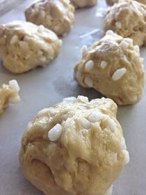 several cookies are on a baking sheet ready to be baked