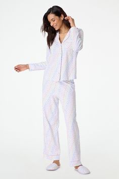 Stay cozy in bed in these new soft and plush PJs that feature our chic hearts print in a vibrant multi-rainbow colorway. This pajama set includes a long-sleeve polo top and matching bottoms. 4 Buttons Chest Pocket Elastic Waistband Materials and Care 100% Premium Cotton Cold Wash, with like colors. Do not bleach Tumble dry low (Line dry recommended). Warm iron if needed Imported Measurement Information Model Wears Size Small Model Height: 5' 10.5" Size S Length: 25" (from Shoulder) Size S Sleeve Length: 24" (from Shoulder) Size S Inseam: 28.5" Cozy In Bed, Hearts Print, Roller Rabbit, Footie Pajama, Polo Top, Birthday List, Sleepwear & Loungewear, Shipping Orders, Long Sleeve Pyjamas