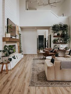 a living room filled with furniture and a fire place in the middle of a room