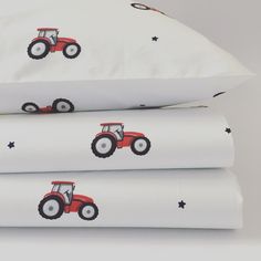 three pillow cases with tractors on them