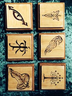 four wooden stamps with different designs on them