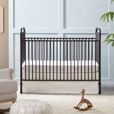 a baby crib in the corner of a room