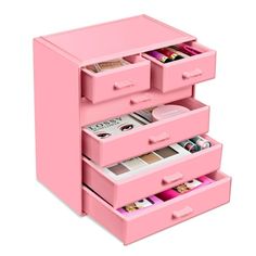 three pink drawers are stacked on top of each other, with magazines in the bottom drawer