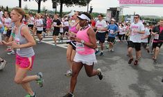 a group of people running in a marathon