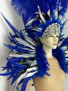 We make and ship our items really fast if you need it for a specific date please let us know. or call/text us at 954-3051817 to complete your order over the phone Blue and Silver Cocktail feather collar with nandu feathers Ostrich feather headdress with cocktail feathers and a Silver Sequin and crystal crown Glitter elastic harness very light and easy to wear The silver cocktail feathers have a black background Therefore some black color is seen on them Gold cocktail is also available to replace Blue Costume Hat For Carnival, Blue Costume Hats And Headpieces For Carnival, Blue Headpieces For Carnival, Elastic Harness, Feather Collar, Silver Cocktail, Feather Headdress, Azul Real, Gold Cocktail