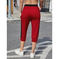 Elevate your activewear with the KOJOOIN Women's Color Block Jogger Pants, a blend of retro charm and contemporary functionality. These capri-length sweatpants are designed to make a statement while providing unmatched comfort and versatility.

- **Size:** 2XL
- **Material:** 60% Polyester, 35% Rayon, 5% Spandex
- **Color:** Red with color block design
- **Gender:** Female
- **Features:** Drawstring waist for adjustable fit, pockets for practicality, breathable and stretchy fabric

Ideal for a r Capri Sweatpants, Female Features, Tapered Joggers, Bottom Workout, Fitness Trends, Drawstring Jogger, Yoga Pant, Leisure Activities, Fleece Pants