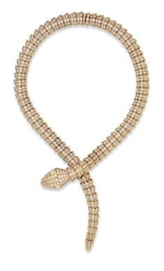 A DIAMOND ‘SERPENTI’ NECKLACE, BY BULGARI: Designed as an overlapping snake, with circular-cut diamond scales and pear-shaped diamond eyes, mounted in gold, 37.5 cm. Signed Bulgari, Italy, no. 9667. Via Christie's. Bvlgari Serpenti Necklace Gold, Chanel Accessories Jewelry, Necklace Bulgari, Bvlgari Snake Necklace, Bvlgari Gold, Bulgari Jewelry, Bvlgari Jewelry, Diamond Eyes, Snake Jewelry