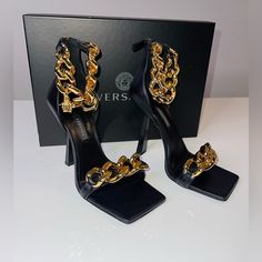 Versace Medusa Chain / News High Heel Sandals Black With Gold Chain 37.5 Perfect Condition Same Day Shipping Nr Included: Original Box Authenticity Certificate Travel Bag Formal Heels With Chain And Round Toe, Elegant High Heels With Chain Print, Designer Gold Heels With Chain Strap, Formal Chain Print Heels, Gold Heels With Chain Print For Formal Occasions, Formal High Heels With Gold Chain, Gold Chain Print Evening Heels, Gold Chain Print Heels For Evening, Formal Gold Heels With Chain Print