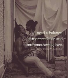 a man and woman sitting next to each other in front of a building with the words i need a balance of independence and soul - something love