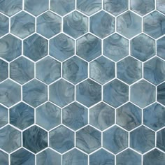 an image of a tile pattern that looks like hexagonals in blue and grey