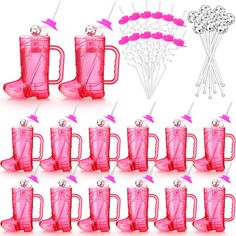 a set of pink plastic cups with straws and flowers in the middle are shown