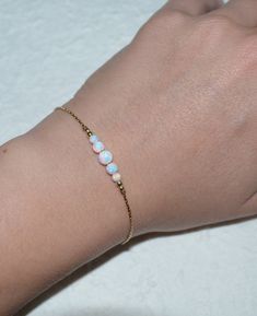 This is a very beautiful and delicate Sterling Silver bracelet with white opal beads bar. This is a very versatile item that adds a bit of style to any outfit. *** M a t e r i a l s *** Your bracelet can be made of the following materials: Sterling Silver or 14k Gold Filled. White Opal Bracelet, Eating Videos, Aliexpress Hair, Clean Jewelry, Titanic Jewelry, Asmr Eating, Instrumental Music, Body Chains, Dj Khaled