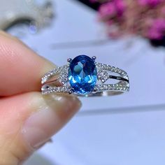 >>>> NATURAL TOPAZ RING <<<< Topaz size : 6*8 mm Topaz shape: Oval Cut gemstoneMain stone : blue topaz Side  stone : CZ diamond (cubic zircon)Metal color: silver, rose gold, gold  Metal type : 925 sterling silver,18k rose gold plated, 18K gold plated >>>> CUSTOM METALS <<<< Ring Size: From US #4 to US #14.Supply customized Solid Gold (18K White Gold/ Rose Gold/ Gold). Customize Engraved: Accept name or some simple icon on ring band. It's laser engr Blue Topaz Cubic Zirconia Promise Ring, Blue Cubic Zirconia Topaz Promise Ring, Blue Open Topaz Promise Ring, Blue Diamond Topaz Promise Ring, Blue Topaz Diamond Ring For Promise, Fine Jewelry Sapphire Ring In Light Blue, Blue Topaz Birthstone Ring Fine Jewelry, Blue Topaz Promise Ring With Prong Setting, Light Blue Sapphire Rings In Fine Jewelry Style