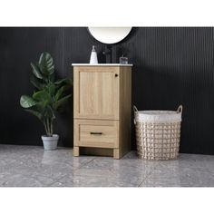 a bathroom with a sink, mirror and basket next to the toiletries on the floor