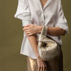 Perfectly suited to round out a look, the Rebecca Mini Woven features our iconic woven Nappa leather in a curved clutch style. Lined in soft suede with a magnetic closure and zippered inside pocket, this Italian-made handbag opens to reveal a roomy interior (fitting keys, phone, and a small wallet) before easily cinching together to glide over the wrist. TRANSLATE with x English Arabic Hebrew Polish Bulgarian Hindi Portuguese Catalan Hmong Daw Romanian Chinese Simplified Hungarian Russian Chines Chic Clutch With Braided Handles For Everyday, Chic Everyday Clutch With Braided Handles, Chic Woven Leather Clutch For Everyday Use, Chic Everyday Woven Leather Clutch, Leather Clutch With Braided Handles For Evening, Evening Leather Clutch With Braided Handles, Chic Evening Shoulder Bag With Interwoven Design, Chic Pouch Clutch With Intrecciato Weave, Chic Woven Bag For Formal Occasions