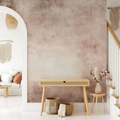 a living room with a couch, table and vases on the floor next to it