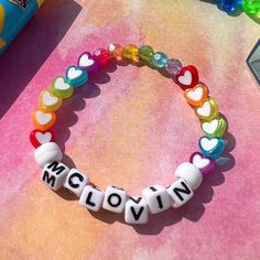 mclovin bead bracelet 🌈🌺 details ❥ approximately 6.5 inches & super stretchy 🐛 ❥ can be adjusted to your sizing :) 🌈 ❥ want this same design but want it to say something else? i can do that ❤️🔥 Multicolor Round Beads Kpop Jewelry, Handmade White Beaded Rave Bracelets, White Handmade Beaded Bracelets For Rave, White Rave Bracelets Gift, White Rave Beaded Bracelets For Friendship, White Beaded Kpop Bracelets, Personalized Multicolor Beaded Bracelets In Kpop Style, Personalized Multicolor Beaded Bracelets Kpop Style, White Beaded Bracelets With Letter Beads Kpop Style