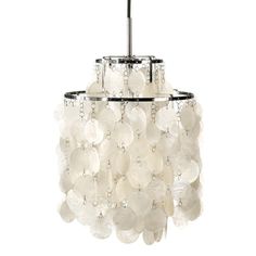 a chandelier with white shells hanging from it's ceiling, and one light fixture