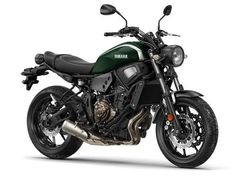 a green and black motorcycle on a white background