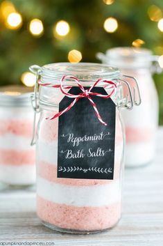 pink and white bath salts in a glass jar with a chalkboard label on it