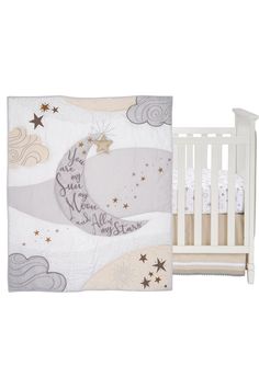 a white crib bed with a baby's name on it and stars in the sky