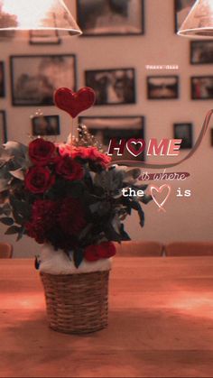 a basket filled with flowers sitting on top of a wooden table