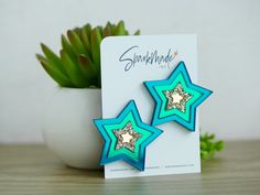 "Looking for a statement piece to be the star of the party? Look no further than our Party Star Mirror Acrylic Statement Stud Earrings! These earrings are not only fun and playful but also make a bold fashion statement. Crafted with attention to detail and quality of craftsmanship, these earrings are made of a combination of mirror and glitter acrylic that catches the light and adds a touch of sparkle to your style. Their unique star shape and color combinations make them the perfect party state Star-shaped Stainless Steel Earrings, Red Star-shaped Earrings For Party, Red Star-shaped Party Earrings, Multicolor Star-shaped Party Earrings, Star Mirror, Cheap Multicolor Star-shaped Earrings, Mirror Earrings, Statement Stud Earrings, Star Earring