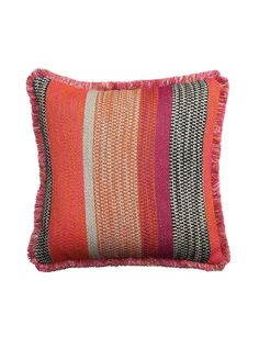 an orange and pink striped pillow with fringes on the front, sitting against a white background