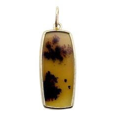 This is part of Chairish’s Fine Jewelry assortment.  This 14k gold Landscape Agate pendant is a Kirsten’s Corner Signature piece. Landscape Agate is formed when the crystalline structure of the rock is still molten. The liquid is arrested in place to create shapes that, even after they harden, appear to be fluid. Patterns resembling trees, flowers, and hillsides can often be seen in Landscape Agate, hence its name. The intricacy of these agate structures is hard to believe--they often look like Gold Agate Jewelry With Polished Finish, Luxury Gold Agate Necklaces, Elegant Hand-strung Agate Necklace, Elegant Agate Pendant Gemstone, Luxury Agate Pendant Gemstone, Crystalline Structure, One-of-a-kind Agate Pendant Jewelry, Black Dots, Agate Pendant