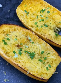 two yellow squash halves with parmesan cheese and green onions