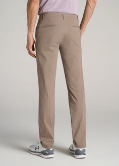 About Our Men's Tall Pants These extra-long chinos strike the perfect balance between classic and comfortable. They're designed to look like a pair of tapered chinos but are made of a lighter stretchy fabric that provides plenty of room for movement so you can tee off on the golf course, take the dog for a walk or grab dinner with friends at that new restaurant in town. We know how hard it is to find men's tall pants, which is why we made sure this pair had an extra-long inseam measured specific Casual Business Chinos With Tapered Leg, Business Casual Chinos With Welt Pockets, Classic Tapered Ankle-length Chinos, Solid Color Tapered Leg Chinos With Welt Pockets, Solid Chinos With Tapered Leg And Welt Pockets, Tapered Leg Chino Cotton Twill Chinos, Solid Tapered Leg Chinos In Cotton Twill, Solid Color Slim Fit Chinos With Tapered Leg, Tapered Leg Chinos With Welt Pockets