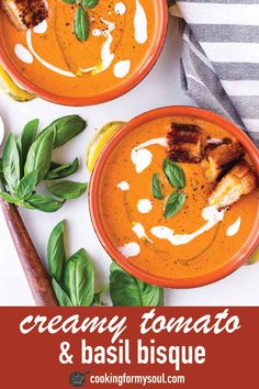 two bowls of creamy tomato and basil soup