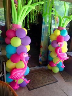 some balloons that have flamingos on them