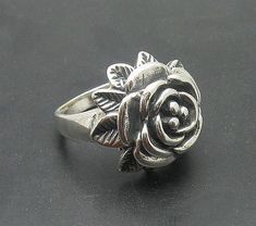 Sterling silver ring 925/1000, flower. Stamped 925.Approximate weight 10.0 grams. Top width 2.2cm (0.88 inches). All our jewels are made from solid sterling silver 925/1000 and are carefully crafted by hand in our family workshop. We dispatch your orders in 5 working days, worldwide and the postage is $5. We ship registered priority mail. Please allow 5-7 working days for delivery in Europe and 10-15 working days outside Europe. For any questions - please do not hesitate to contact me! Silver Flower-shaped Rings With Rose Design, Hallmarked Sterling Silver Flower Ring, Silver Flower Ring Stamped 925, Hallmarked Silver Flower Ring, Formal Sterling Silver Flower Ring, Sterling Silver Flower Ring For Formal Occasions, Sterling Silver Rose Design Flower Ring, Formal Flower Ring Stamped 925, Formal Flower Shaped 925 Silver Ring