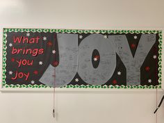 a bulletin board with the word joy written on it