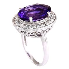 Stamped: 14K White Gold Total Ring Weight: 7.8 Grams Ring Length: N/ARing Width: N/A Gemstone Weight: Total Natural Amethyst Weight is 6.01 Carat (Measures: 14.90x11.05 mm) Color: Purple Diamond Weight: Total Natural Diamond Weight is 0.80 Carat Quantity: 24 Color: F-G, Clarity: VS2-SI1 Face Measures: 19.85x17.10 mm Sku: [703401W] 14k White Gold Diamond Ring, Amethyst And Diamond Ring, Purple Diamond, White Gold Diamond Rings, Gold Diamond Ring, White Gold Diamonds, Color Purple, Gold Diamond, Natural Diamonds