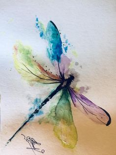 a watercolor painting of a dragonfly on white paper