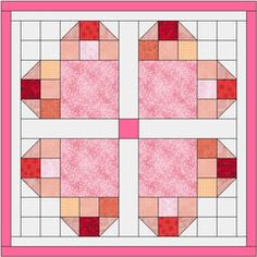 a pink and white quilt with four squares on the front, two in the middle