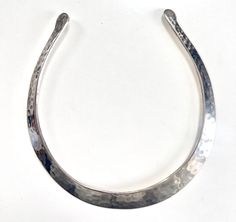 Vintage handcrafted silver plated neck ring necklace/  choker from France.  Modernist, minimum and statement jewellery for her.  Hammered silver with beautiful texture.  Measures: 1.4cm widest part Inner cycle : 11.8 cm  diameter From end to end length: 35.5cm  / 14"  Opening Gap: 7cm/ 2.8" wide.  The opening is adjustable, suits small/medium neck.  In good vintage condition, there is very small wear and patina.  Send from France with tracking number.  Everything I share here is vintage, it mean