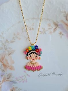 A beautiful handmade Frida patterned. It's displayed both sides. This is made with genuine Miyuki beads. It is high quality Japanese beads and brilliant colours and shape. It's came with a small gold colour chain.  The measurements; - Frida is 2.5cm. width from the top of the head and 4cm. height. - The necklace length is 55cm. (Without pendant)   This necklace will come with a small jewellery sheer drawstring pouch. Please feel free to contact me for the cost of delivery to everywhere else if outside Australia. Please note: product colour may slightly vary due to photographic lighting sources or your monitor settings. Miyuki Bead Necklace, Japanese Beads, Miyuki Bracelet, Daughter Quotes, Miyuki Beads, Delica Beads, Gold Colour, Drawstring Pouch, Photographic Lighting