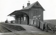 an old photo of a train station