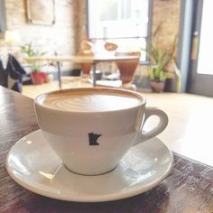 a cup of coffee sitting on top of a saucer