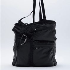 Three Front Pockets. Carabiner Detail. Shoulder Straps. Lined Interior With Two Compartments And Zip Pocke Height X Length X Width: 13.4 X 10.6 X 3.9 Inches (34 X 27x 10 Cm) Black Outdoor Bag With Double Handle, Zara Black Bag For Everyday Use, Black Zara Bag For Everyday Use, Zara Black Bag For Daily Use, Versatile Zara Bag For Everyday Use, Versatile Zara Bags, Zara Black Casual Bag, Casual Zara Bag For On-the-go, Zara Travel Bag With Zipper Closure