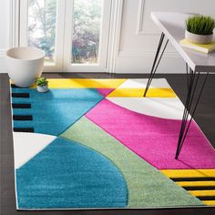 a colorful area rug with various colors and shapes